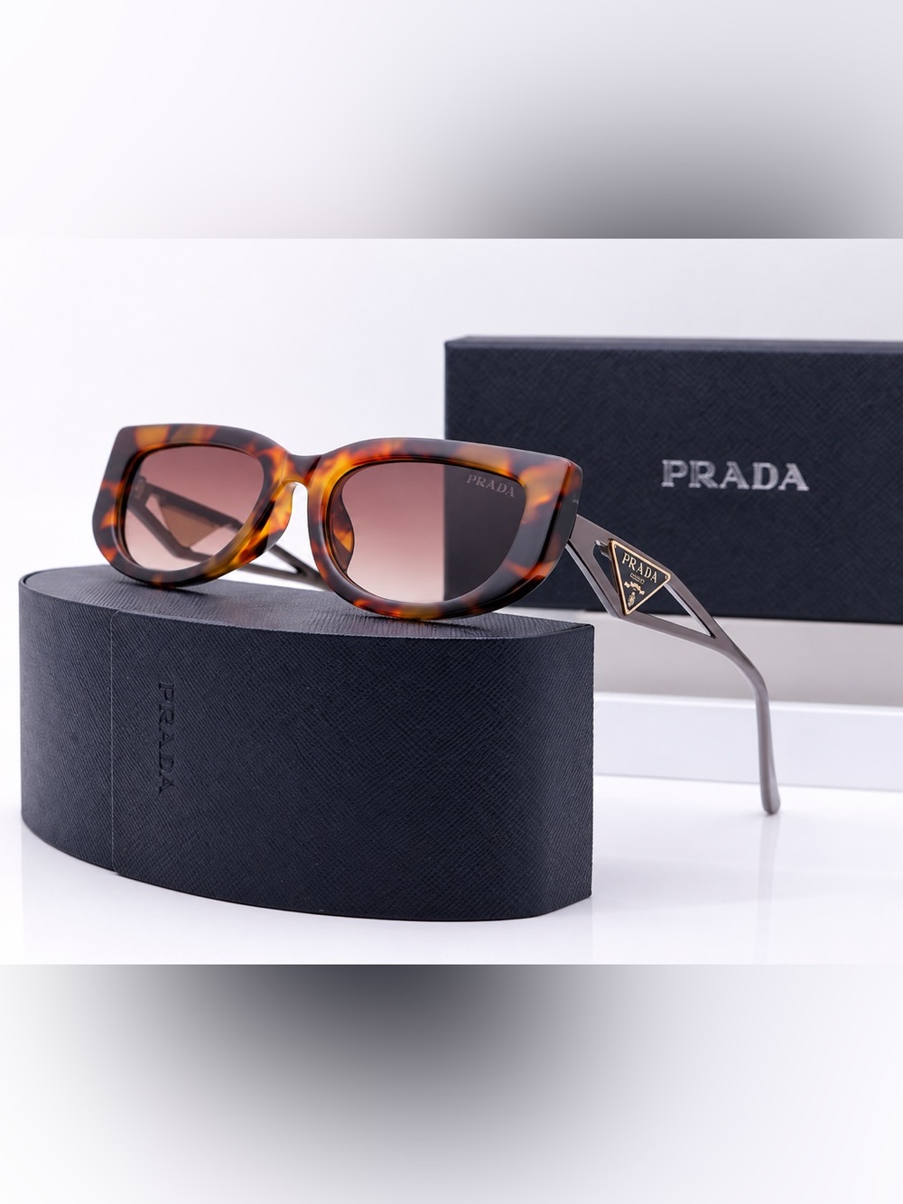 Prada Women’s Tortoiseshell Cat-Eye Sunglasses with Brown Gradient Lenses